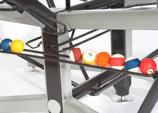 Glass top pool table ball return system