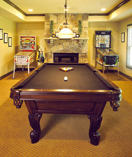 Home Gameroom With Pool Table and Pinball